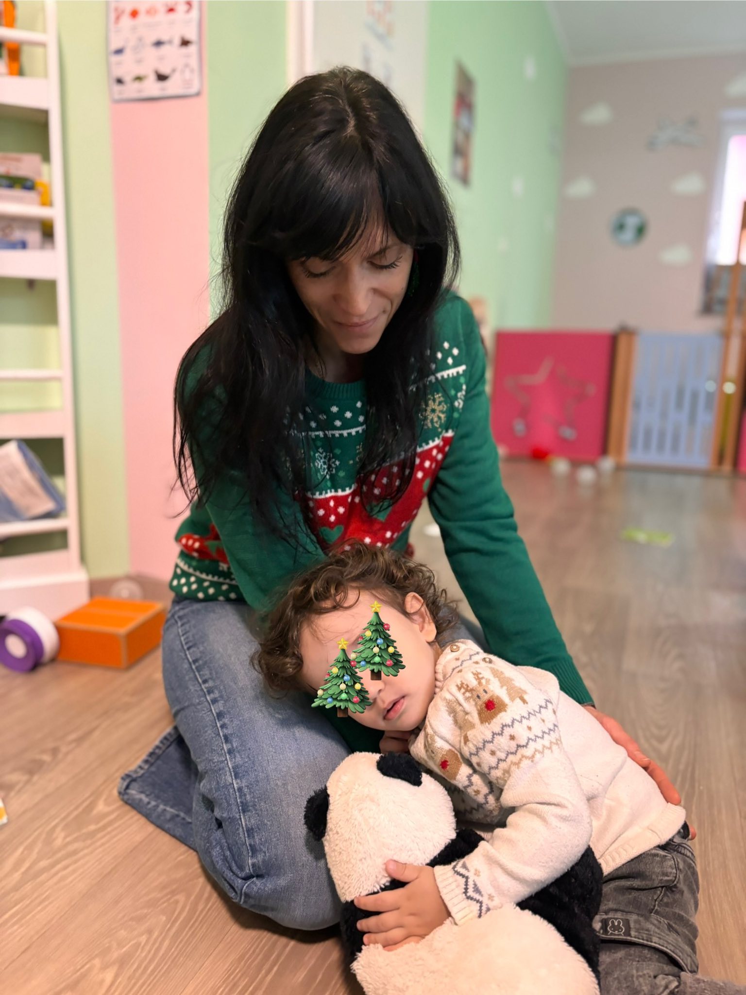 Settling-in moment in the nursery with a caregiver and a child